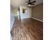 Inviting living room with ceiling fan and light wood-look flooring at 11221 N 91St Dr, Peoria, AZ 85345