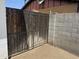 Wooden and metal yard gate along a block wall at 11221 N 91St Dr, Peoria, AZ 85345