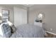 Cozy bedroom featuring natural light, a large closet and warm wood floors at 1145 E Gleneagle Dr, Chandler, AZ 85249