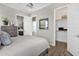 Bright bedroom with wood-look tile floors, closet access, and ensuite bathroom at 1145 E Gleneagle Dr, Chandler, AZ 85249