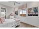 Bright bedroom with white shiplap walls, decorative art, and a cozy daybed at 1145 E Gleneagle Dr, Chandler, AZ 85249