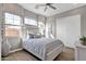 Charming bedroom with a large window, ceiling fan, and a comfortable queen-size bed at 1145 E Gleneagle Dr, Chandler, AZ 85249