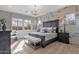 Stylish bedroom with decorative brick, large windows, and dark wood flooring at 1145 E Gleneagle Dr, Chandler, AZ 85249