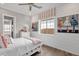 Bright bedroom with white shiplap walls, decorative art, and a cozy daybed at 1145 E Gleneagle Dr, Chandler, AZ 85249