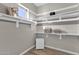 Walk-in closet offers ample storage with adjustable shelving for personalized organization and convenience at 1145 E Gleneagle Dr, Chandler, AZ 85249