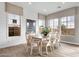 Bright dining room with large windows, a spacious table, and a modern chandelier at 1145 E Gleneagle Dr, Chandler, AZ 85249