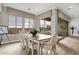 Elegant dining area featuring a large table and chairs with natural light streaming in at 1145 E Gleneagle Dr, Chandler, AZ 85249