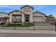 Beautiful single-Gathering home featuring a gray brick exterior, manicured lawn and front gate at 1145 E Gleneagle Dr, Chandler, AZ 85249