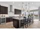Spacious kitchen features a large center island, dark cabinetry, and stainless steel appliances at 1145 E Gleneagle Dr, Chandler, AZ 85249