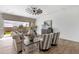 Bright living room with wood floors, white shiplap walls, and neutral decor with a sliding glass door to the outside at 1145 E Gleneagle Dr, Chandler, AZ 85249