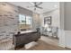 Modern office space features a brick accent wall, wood-look flooring, and modern furnishings at 1145 E Gleneagle Dr, Chandler, AZ 85249