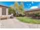 Backyard features a green lawn, mature trees, and basketball hoop at 1161 N Cole Dr, Gilbert, AZ 85234