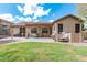 A view of the house from the yard showing a covered patio at 1161 N Cole Dr, Gilbert, AZ 85234