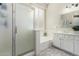 Bright bathroom featuring a shower, tub, and dual sink vanity with decorative tile flooring at 1161 N Cole Dr, Gilbert, AZ 85234