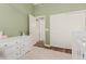 Bedroom featuring a dresser and closet for storage, with an ensuite bathroom at 1161 N Cole Dr, Gilbert, AZ 85234