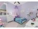 Charming bedroom decorated with a canopy bed, soft colors and ample natural light at 1161 N Cole Dr, Gilbert, AZ 85234
