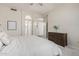 Bright bedroom featuring a comfortable bed and hardwood dresser at 1161 N Cole Dr, Gilbert, AZ 85234