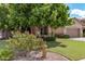 Charming single-story home boasts lush landscaping, a well-maintained lawn, and a welcoming curb appeal at 1161 N Cole Dr, Gilbert, AZ 85234