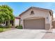 Single-story home showcases a spacious two-car garage, complemented by low-maintenance landscaping at 1161 N Cole Dr, Gilbert, AZ 85234