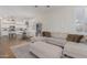 Comfortable living room with a large sectional, ottoman, and natural light at 1161 N Cole Dr, Gilbert, AZ 85234