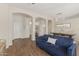 Spacious open-concept living space featuring wood-style floors and natural light at 1161 N Cole Dr, Gilbert, AZ 85234