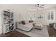 Cozy living room featuring a sectional sofa, stylish decor, and ample natural light at 1161 N Cole Dr, Gilbert, AZ 85234
