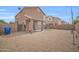 Large backyard with a covered patio, low-maintenance desert landscaping, and block wall at 12022 W Belmont W Dr, Avondale, AZ 85323