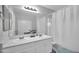 Bathroom with double sinks and a shower with curtains at 12022 W Belmont W Dr, Avondale, AZ 85323