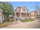 Two-story home with covered porch, stone accents, and a well-maintained front yard at 12022 W Belmont W Dr, Avondale, AZ 85323