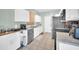 Bright kitchen featuring white cabinets, tile flooring, and stainless-steel appliances at 12022 W Belmont W Dr, Avondale, AZ 85323