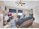 Cozy living room with tile flooring, ceiling fan, and bright windows with modern blinds at 12022 W Belmont W Dr, Avondale, AZ 85323