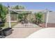Seating area featuring a pergola, chairs, table, and brick pavers at 13012 N 26Th Dr, Phoenix, AZ 85029