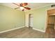 Bedroom with hard surface floors, ceiling fan, and closet at 13012 N 26Th Dr, Phoenix, AZ 85029