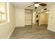 Bright bedroom features mirrored closet doors, a ceiling fan and flooring at 13012 N 26Th Dr, Phoenix, AZ 85029