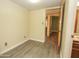 Bright bedroom features modern floors and access to another room at 13012 N 26Th Dr, Phoenix, AZ 85029