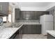 A kitchen with stainless appliances, granite countertops, and modern backsplash at 13012 N 26Th Dr, Phoenix, AZ 85029