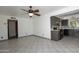 Open concept living room featuring tile flooring and a ceiling fan at 13012 N 26Th Dr, Phoenix, AZ 85029