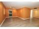 Inviting living room with stylish floors, track lighting, orange walls, and convenient access to other living spaces at 13012 N 26Th Dr, Phoenix, AZ 85029