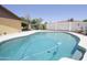 Sparkling in-ground pool with a spacious deck, perfect for entertaining guests in the backyard at 13012 N 26Th Dr, Phoenix, AZ 85029