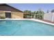 Backyard view of in-ground pool, patio area, and lush green landscaping at 13012 N 26Th Dr, Phoenix, AZ 85029