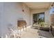 Cozy outdoor space featuring classic furnishings and a sliding door offering seamless transition to the indoors at 1396 E Leslie Ave, San Tan Valley, AZ 85140