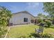 Expansive backyard with lush lawn, perfect for outdoor relaxation and play, featuring mature trees at 1396 E Leslie Ave, San Tan Valley, AZ 85140