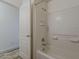 Bathroom featuring a tiled shower-tub combo, and neutral walls at 1396 E Leslie Ave, San Tan Valley, AZ 85140