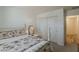 Comfortable bedroom with carpet, white walls, closet, and a vintage style four poster bed at 1396 E Leslie Ave, San Tan Valley, AZ 85140