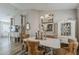 Elegant dining room with decorative mirrors, chandelier, and stylish upholstered chairs at 1396 E Leslie Ave, San Tan Valley, AZ 85140