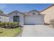 Charming single-story home featuring a tile roof, two-car garage, and well-maintained landscaping at 1396 E Leslie Ave, San Tan Valley, AZ 85140