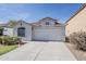 Beautiful single-story home with tile roof, two-car garage, and desert landscaping at 1396 E Leslie Ave, San Tan Valley, AZ 85140
