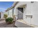 Inviting entryway with an arched porch, secure screen door, and manicured landscaping at 1396 E Leslie Ave, San Tan Valley, AZ 85140