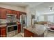 Well-equipped kitchen featuring stainless steel appliances and granite countertops at 1396 E Leslie Ave, San Tan Valley, AZ 85140