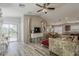 Spacious living room with wood-look tile flooring and an open layout at 1396 E Leslie Ave, San Tan Valley, AZ 85140